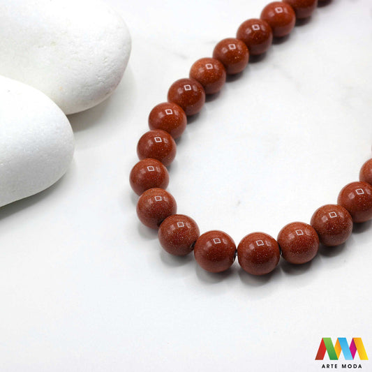 sunčev kamen poludragi sunca sunstone ljekovito kamenje kristali mineral nakit perle privjesci radost optimizam sreća energija pozitivnost meditaciju narukvica čakre prirodni sunca blistavi poludragi kamen toplom narančasto-zlatnom sjaju i inkluzijama koje podsjećaju na sunčeve zrake Sunčev kamen donosi radost optimizam i vitalnost te da pojačava osobnu snagu i karizmu izradu nakita koji zrači pozitivnom energijom i kao moćan saveznik u meditaciji za podizanje raspoloženja arte moda repromaterijal