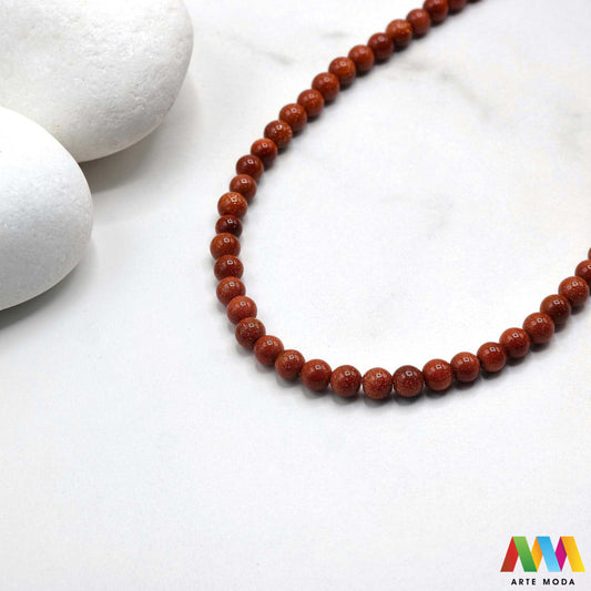 sunčev kamen poludragi sunca sunstone ljekovito kamenje kristali mineral nakit perle privjesci radost optimizam sreća energija pozitivnost meditaciju narukvica čakre prirodni sunca blistavi poludragi kamen toplom narančasto-zlatnom sjaju i inkluzijama koje podsjećaju na sunčeve zrake Sunčev kamen donosi radost optimizam i vitalnost te da pojačava osobnu snagu i karizmu izradu nakita koji zrači pozitivnom energijom i kao moćan saveznik u meditaciji za podizanje raspoloženja arte moda repromaterijal
