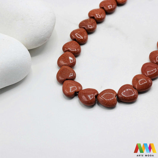 sunčev kamen poludragi sunca sunstone ljekovito kamenje kristali mineral nakit perle privjesci radost optimizam sreća energija pozitivnost meditaciju narukvica čakre prirodni sunca blistavi poludragi kamen toplom narančasto-zlatnom sjaju i inkluzijama koje podsjećaju na sunčeve zrake Sunčev kamen donosi radost optimizam i vitalnost te da pojačava osobnu snagu i karizmu izradu nakita koji zrači pozitivnom energijom i kao moćan saveznik u meditaciji za podizanje raspoloženja arte moda repromaterijal